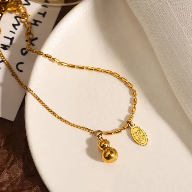 ゴールドアクセサリー 小粒ふたごの宝珠アンクレット